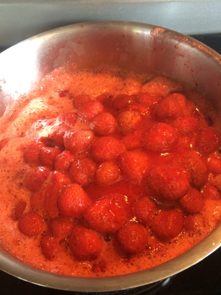 Fresh strawberries reduced halfway