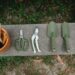 gardening tools on wooden bench in yard